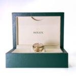 Specialist reviewing artwork, watch documents and luxury items for auction consignment in London