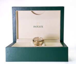 Specialist reviewing artwork, watch documents and luxury items for auction consignment in London